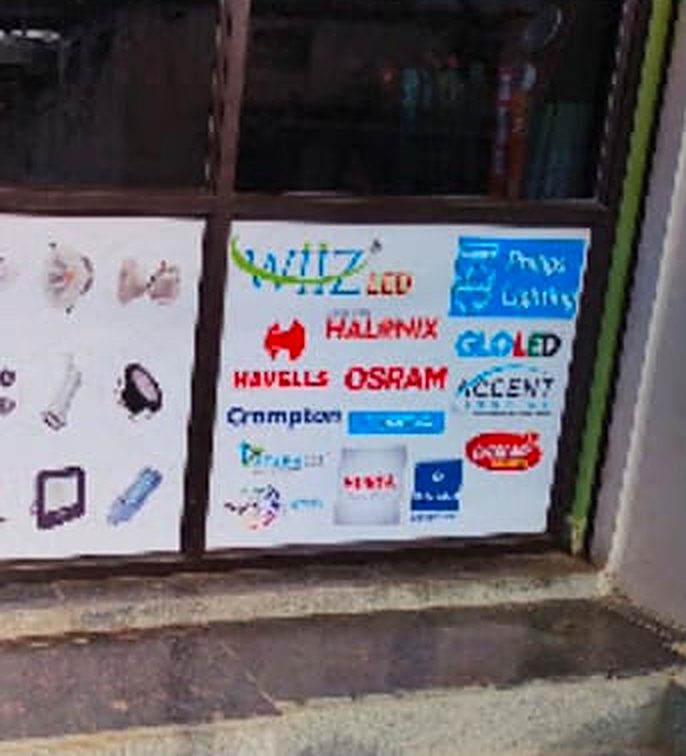S.A Traders shop counter with Havells, Osram, Halonix, WIIZ and Crompton brand boards